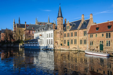 Reflection in the frozen canal in Bruges, Belgium