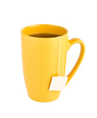 Yellow mug of tea isolated on white background