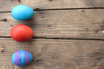 Easter egg on old wooden background with copy space 