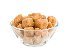 sugar cubes in a bowl on a white background