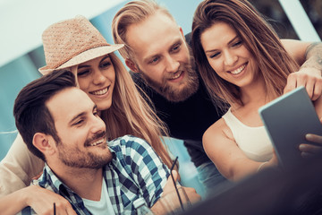 Happy friends making selfie outdoors