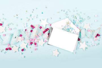 Envelopes with empty card on blue background with  with cute decoration: heart, lace ribbon, stars...
