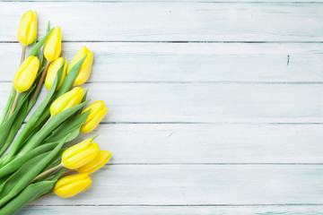 Easter background with yellow tulips