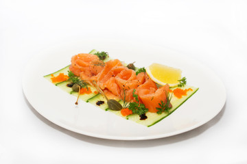 Salted salmon with lemon on white background