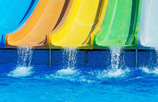 Colorful plastic water-slides in aqua park.