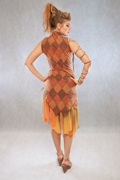Woman in orange and brown outfit fashion studio