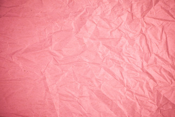 Crumpled recycle pink paper background.