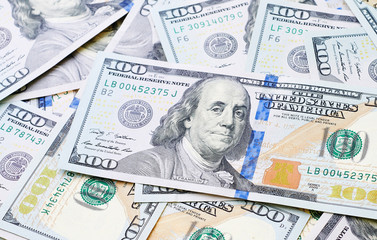 Obraz na płótnie Canvas american bills of hundred dollar as background