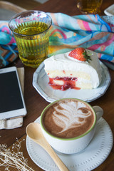 coffee cup and strawberry cake in coffee shop ,coffee relax time