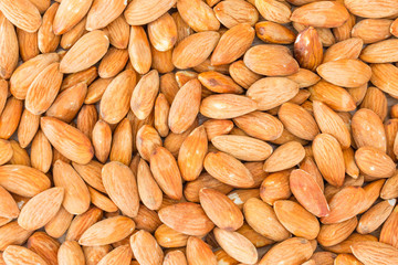 Almonds background. Peeled almonds close-up, For vegetarians.
