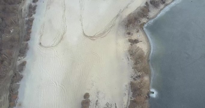 Train motorcycle racer on sand.Aerial view