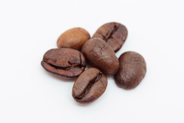 Close up coffee beans on white background.Selective focus.