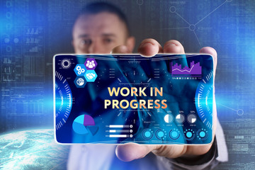 Business, Technology, Internet and network concept. Young businessman showing a word in a virtual...