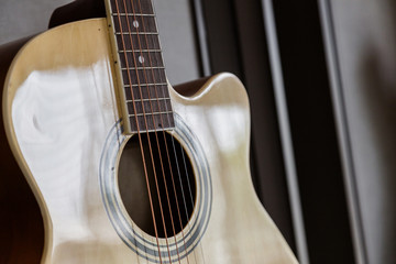 Obraz premium closed up guitar in soft light from window