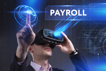 Business, Technology, Internet and network concept. Young businessman working in virtual reality glasses sees the inscription: Payroll