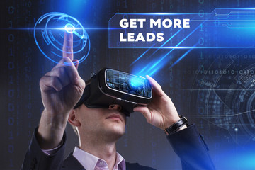 Business, Technology, Internet and network concept. Young businessman working in virtual reality glasses sees the inscription: Get more leads