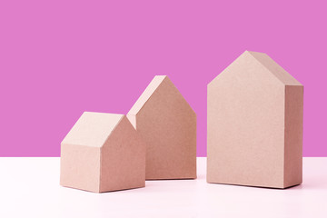 three house model cardboard with free copyspace house loan business concept