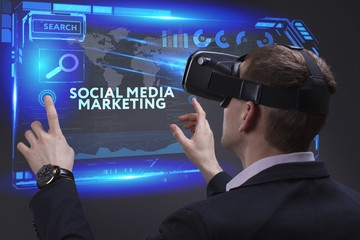 Business, Technology, Internet and network concept. Young businessman working on a virtual screen of the future and sees the inscription: Social media marketing