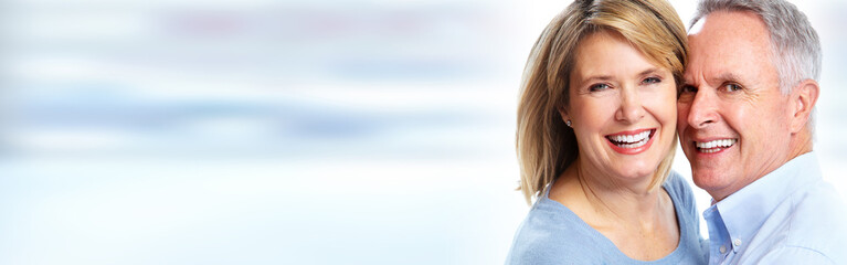 Senior couple smiling.