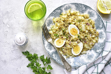 Quinoa salad with cauliflower and boiled eggs.Top view.