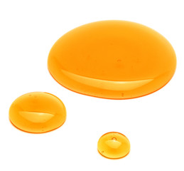 Sweet honey drips isolated on white background. Syrup droplet, nectar drops.