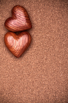 Two wooden hearts on rustic wood background. Valentines days concept.  Love symbol. Greeting card with copy space.