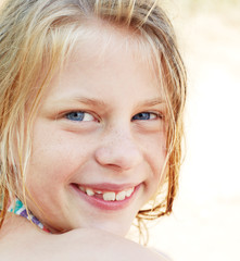 Portrait of a girl with curly hair and blue eyes