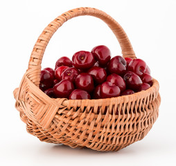 Fototapeta na wymiar cherry berries in wicker basket isolated on white background cutout