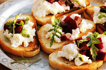 Bruschetta with beet, feta and ruccola