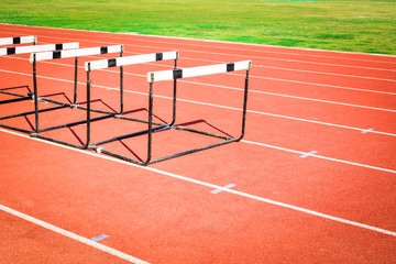 hurdle race on stadium track