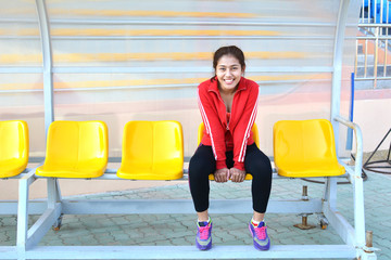 Young women exercise in stadium