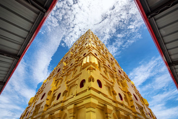 Buddha Khaya Stupa, golden pagoda at Wat Wang Wi Weh Karam ,Beautiful temple with blue sky in Sangkhlaburi - obrazy, fototapety, plakaty