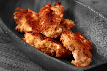 Chicken Goujons breaded and deep fried in a wooden bowl with selective colour