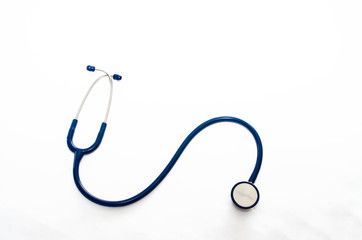 top view of blue stethoscope on white background.