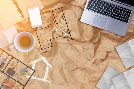 business objects laptop coffee cup notebook and note paper on crumpled paper with free copyspace for your text
