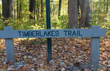 The trail sign in the park.