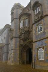 Obraz premium Pena Palace on a foggy and rainy day, Sintra, Portugal