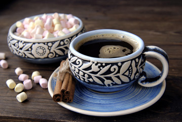 Coffee cup, cinnamon and marshmallow 