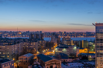 Night Voronezh city after sunset, blue hour, night lights of houses, buildings, 