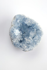 blue crystal Celestite (Celestine ) on a white blurred background