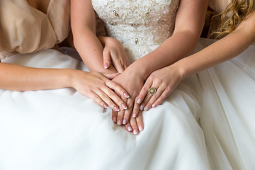 Fototapeta na wymiar Closeup hands of the bride and bridesmaids.