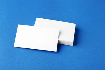 Blank business cards on blue background