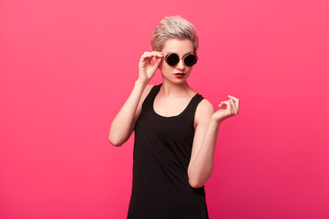 Beauty girl with blond hair posing in studio