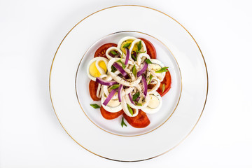 Seafood salad with squid on white background