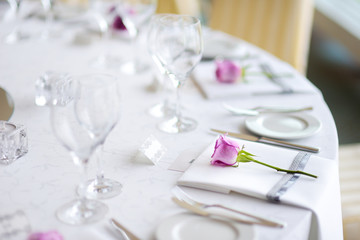 Beautiful table setting with crockery and flowers for a party, wedding reception or other festive event