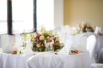 Beautiful table setting with crockery and flowers for a party, wedding reception or other festive event