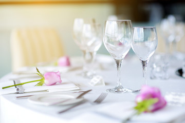Beautiful table setting with crockery and flowers for a party, wedding reception or other festive event