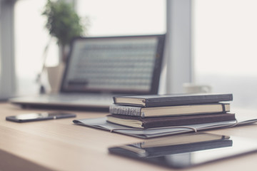 Documents on office table with pen and digital tablet as work space business concept.