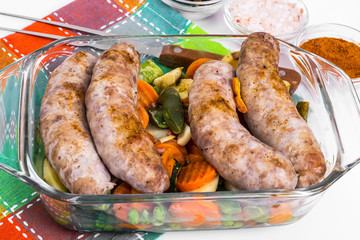 Country sausage with vegetables baked in the shape of glass