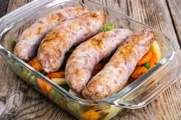 Country sausage with vegetables baked in the shape of glass